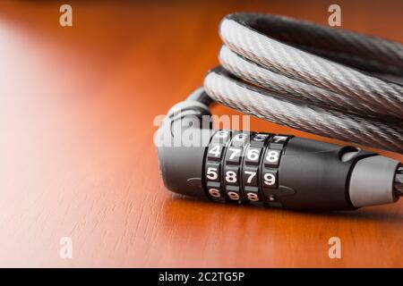 Lock for bycicle on the table Stock Photo