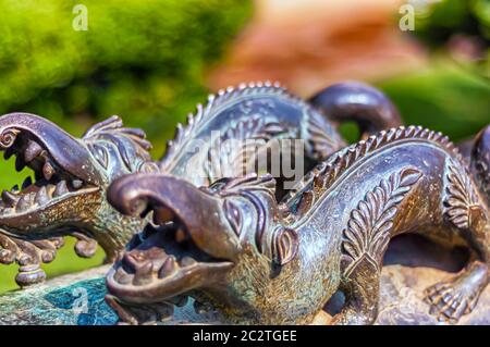 A pair of iron dragons forged atop the barrel of a cannon at Chowmahalla palace in Hyderabad, Telangana, India. Stock Photo