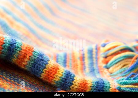Knitted multicolored scarf with fringes Stock Photo