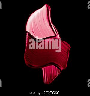 Pink lipstick brush stroke texture isolated on black background Stock Photo