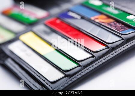 Black leather wallet with credit and discount cards Stock Photo