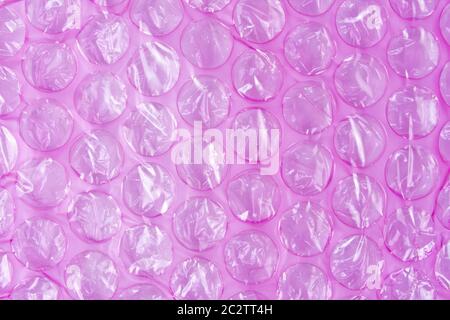 Pink plastic protective bubble wrap background Stock Photo