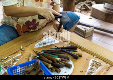 Carver working with wood in Thailand Stock Photo
