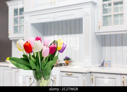 Luxury kitchen made from light wood with kitchen tulips Stock Photo