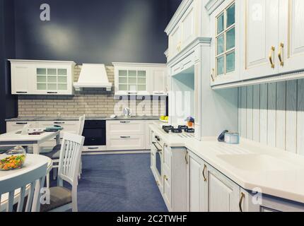 Luxury kitchen made from light wood with kitchen tools Stock Photo