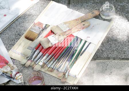 Mixes oil paints on palette with brush Stock Illustration by ©sibstock  #115766214