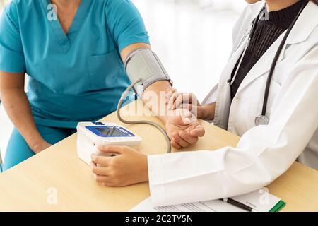 Doctor examine senior woman Stock Photo
