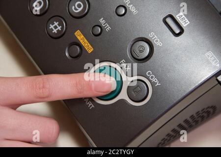 Using fax machine Stock Photo