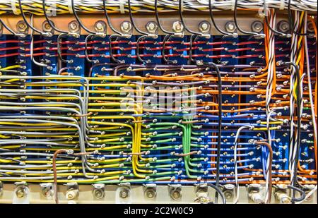 Retro electronic control box with lots of colorful wires Stock Photo