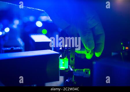 Lasers in a quantum optics lab - Researchers carrying out experiments using lasers Stock Photo