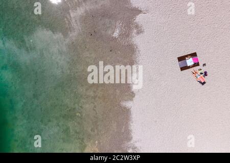 Munich, Germany. 14th Sep, 2017. A woman enjoys the beautiful weather at Langwieder See. (Aerial view with a drone) Credit: Sven Hoppe/dpa/Alamy Live News Stock Photo