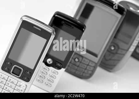 Row of mobile phones. B/W Stock Photo - Alamy
