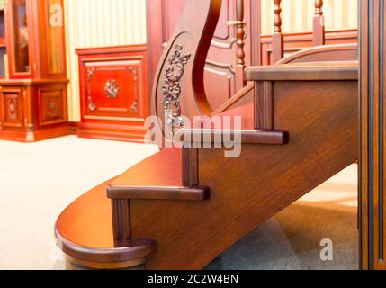 Modern staircase made from nice brown wood closeup Stock Photo