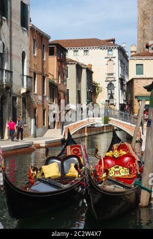 Two Gondolas moored in a small canal in the Dorsoduro area in Venice Italy Stock Photo