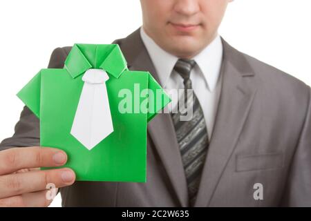 Businessman showing green origami suit in hand Stock Photo