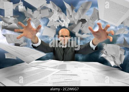 Serious businessman manipulating papers against dramatic blue sky Stock Photo