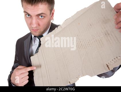 Sad businessman with messy cardboard frame. Isolated on white Stock Photo