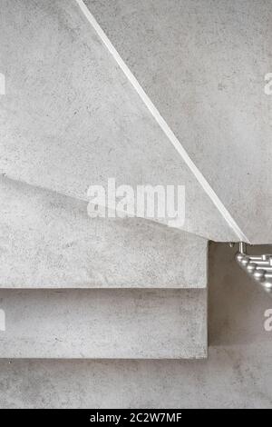 Grey microcement stairs. Stairs viewed from above. Modern design and innovative material. Close - up. Stock Photo