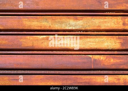 Rusty metal shutter gate. Grungy background texture. Stock Photo