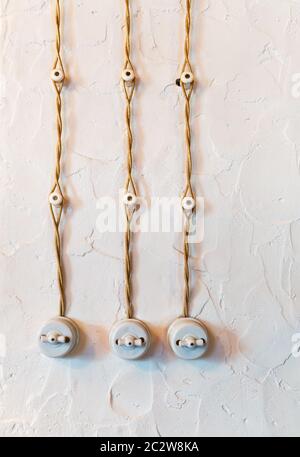 Old electric wiring with three switches on the wall Stock Photo - Alamy