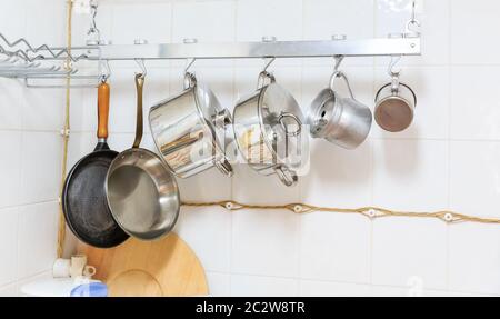 Pans and pots hanging in the kitchen Stock Photo