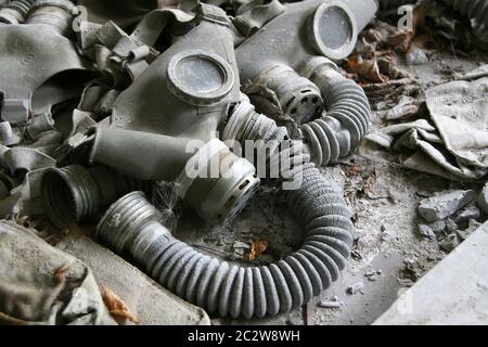 Abandoned gas masks on the floor Stock Photo