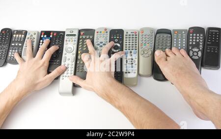 Two hands and led pushing buttons on romote controlers Stock Photo