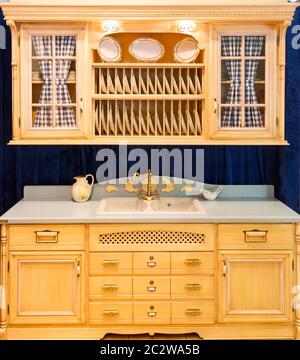 Rustic american kitchen cupboard made from light wood Stock Photo