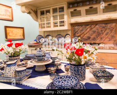 Luxury kitchen made from light wood with kitchen colorful tools Stock Photo