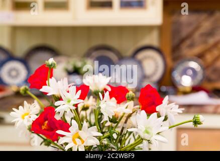 Luxury kitchen made from light wood with nice flowers Stock Photo