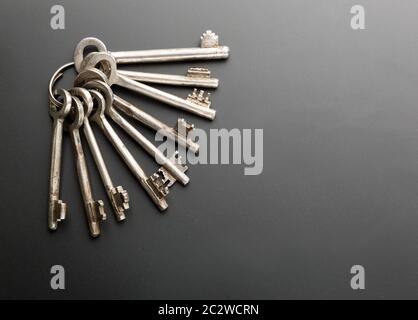 Bunch of keys on grey background Stock Photo