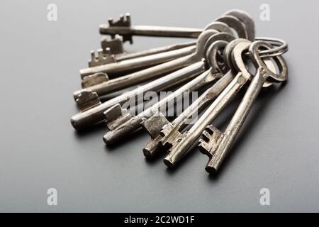 Bunch of old keys on grey background Stock Photo