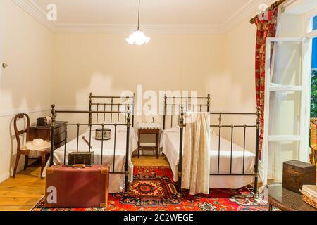 Vintage bedroom in the hotel with two beds Stock Photo