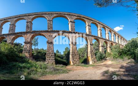 Ancient roman aqueduct Ponte del Diable or Devil's Bridge in Tarragona, Spain. Stock Photo