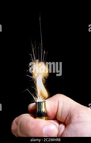 Burning cigarette lighter Stock Photo