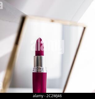 Cosmetics, makeup products set on marble vanity table, lipstick, eyeshadows and make-up brush for luxury beauty and fashion bran Stock Photo