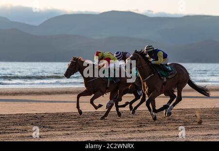 Rossbeigh Beach, Ireland - 25th August 2019: Horse racing on Rossbeigh Beach in County Kerry, Glenbeigh Festival & Races takes place  every year at th Stock Photo