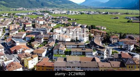 aerial view of the village of Mezzocorona in Trentino Alto Adige -  northern Italy: charming village in the heart of the Piana Rotaliana Königsberg Stock Photo