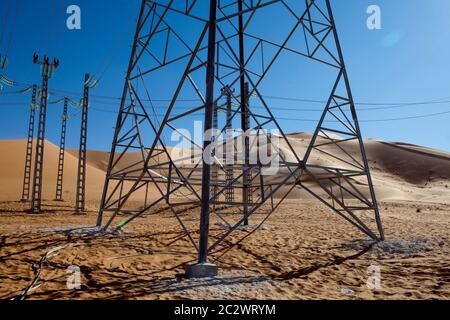 High voltage cable connectors at a sub-station carrying power to a new oil facility in the Sahara desert. Stock Photo