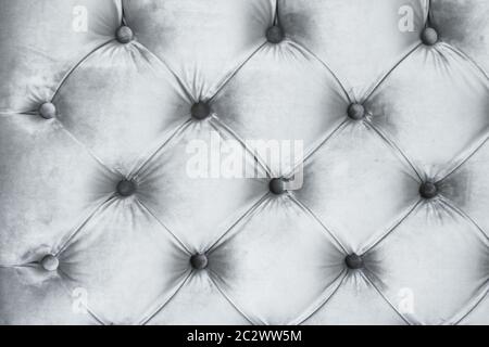 Silver luxury velour quilted sofa upholstery with buttons, elegant home decor texture and background Stock Photo