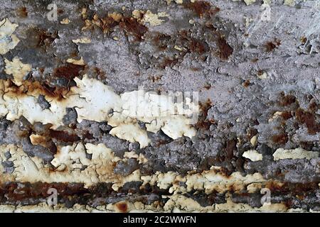 Rusty iron surface with cracks and peeling paint - texture Stock Photo