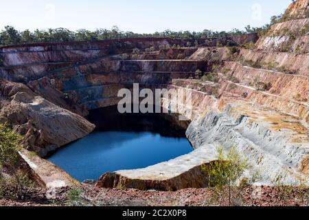 Open cut gold mining complex in Peak Hill, New South Wales, Australia. Pictured is the open cut mine named 'Proprietary' within the complex. Stock Photo