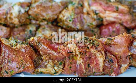 Pork in marinade. Meat for barbecue. Raw fresh meat in sand sauce. Stock Photo