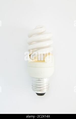 old spiral light bulb on white background Stock Photo