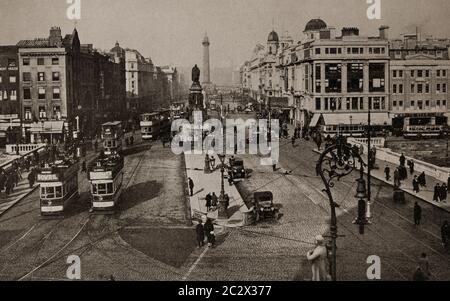 An early 1920's view of the O'Connell Bridge over the River Liffey, in Dublin City, Ireland. Nelson's column in the background was later blown up by the IRA in 1966. Originally photographed by Clifton Adams (1890-1934) for 'Ireland: The Rock Whence I Was Hewn', a National Geographic Magazine feature from March 1927. Stock Photo