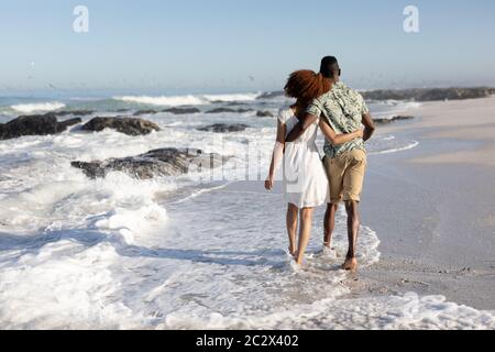 Happy couple spending time together on the beach Stock Photo
