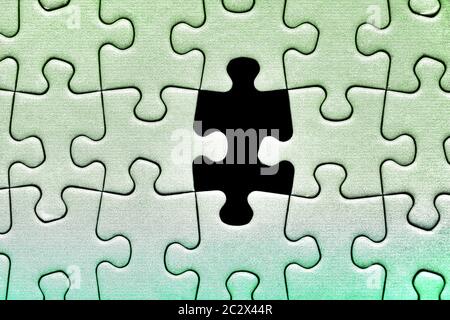 Jigsaw puzzle background, one last piece missing only, almost complete Stock Photo