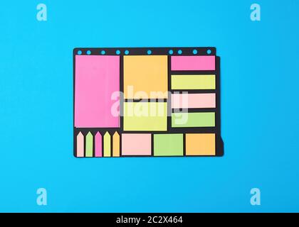 various blank paper multicolored stickers on a black background, close up Stock Photo