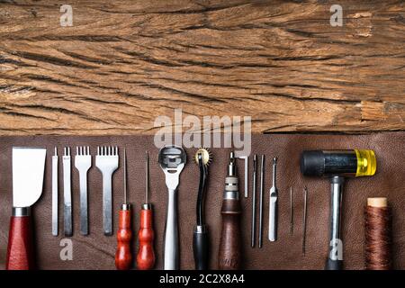 Leather Craft Tools On Desk In Tailoring Workshop Stock Photo