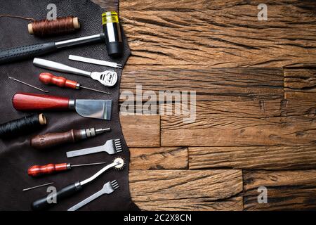 Leather Craft Tools On Desk In Tailoring Workshop Stock Photo